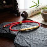 Tibetan Red/Gold String Bracelet - Buddhist Lucky Charm - Professional Photo